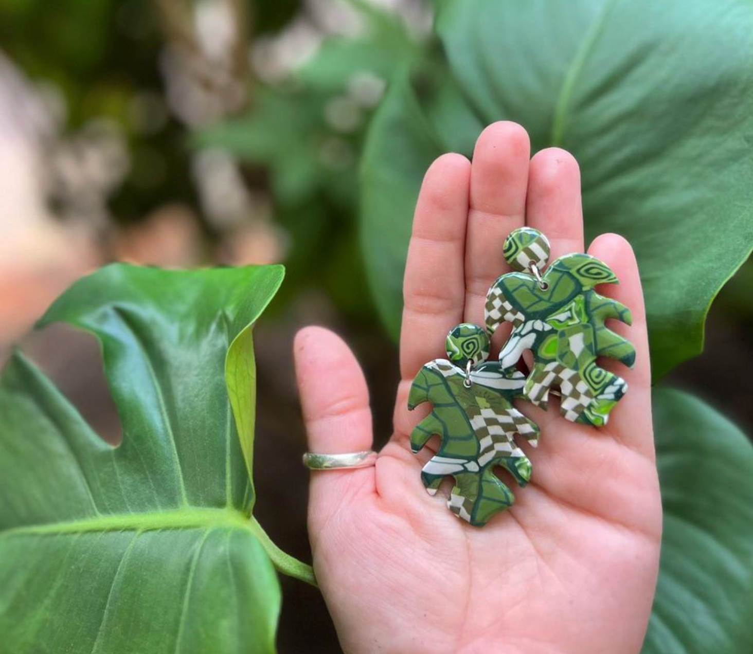Monstera with checker print earrings