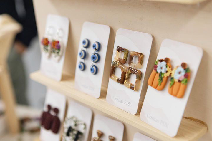 Variety of earrings on a table at a market