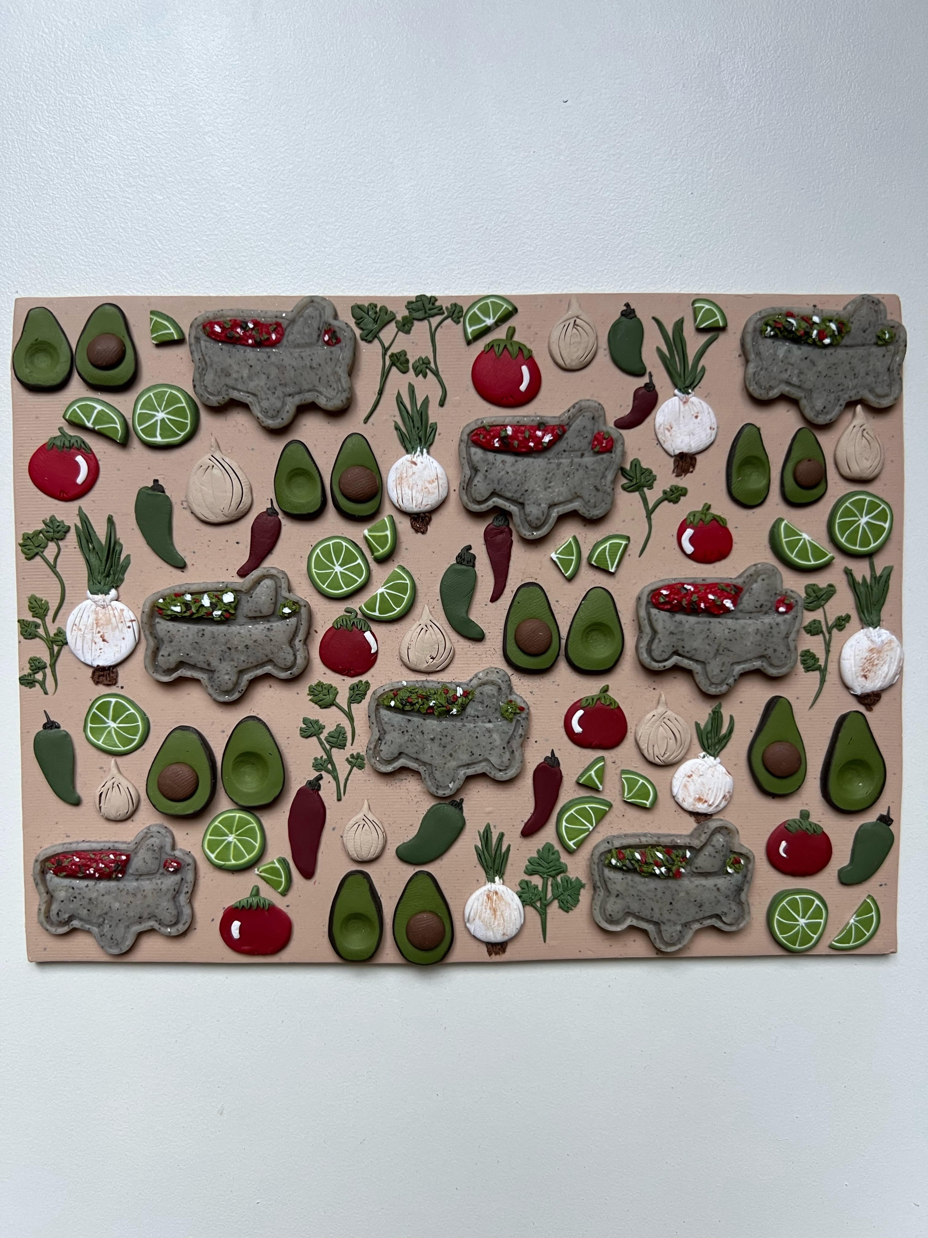 Polymer clay slab of peppers, tomatoes, onions, avocados, and limes